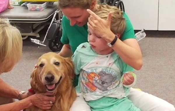 Boy Suffering from Brain Damage Doesn’t Regain Consciousness, Family Bids Farewell as His Dog Cuddles Him