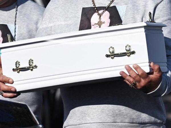 heartbroken-father-of-baby-stabbed-to-death-fights-back-tears-as-he-cradles-his-baby-boy’s-tiny-coffin-at-funeral